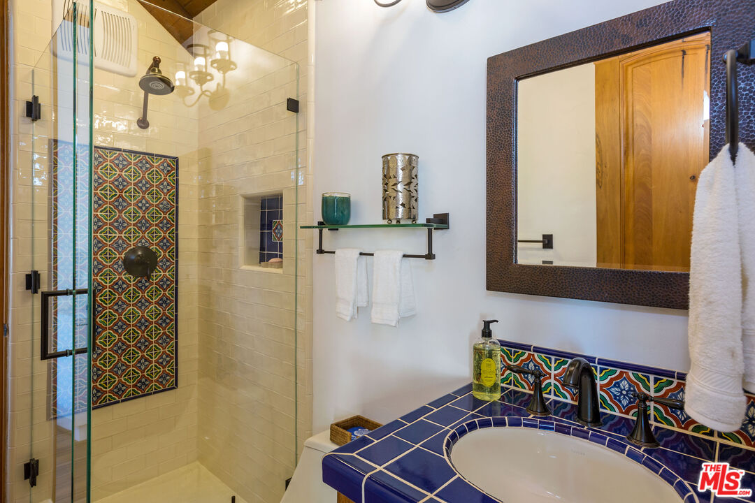 24408 Malibu Road Malibu, CA 90265 - Photo 21 of 44 a bathroom with a sink a toilet and shower