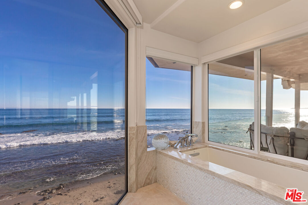 24408 Malibu Road Malibu, CA 90265 - Photo 24 of 39 a bathroom with a bathtub and a sink