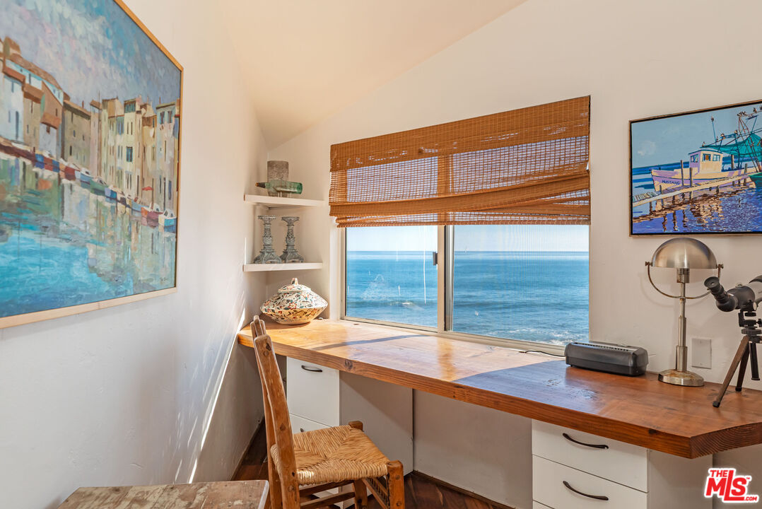 24408 Malibu Road Malibu, CA 90265 - Photo 27 of 39 a room with a table and chairs