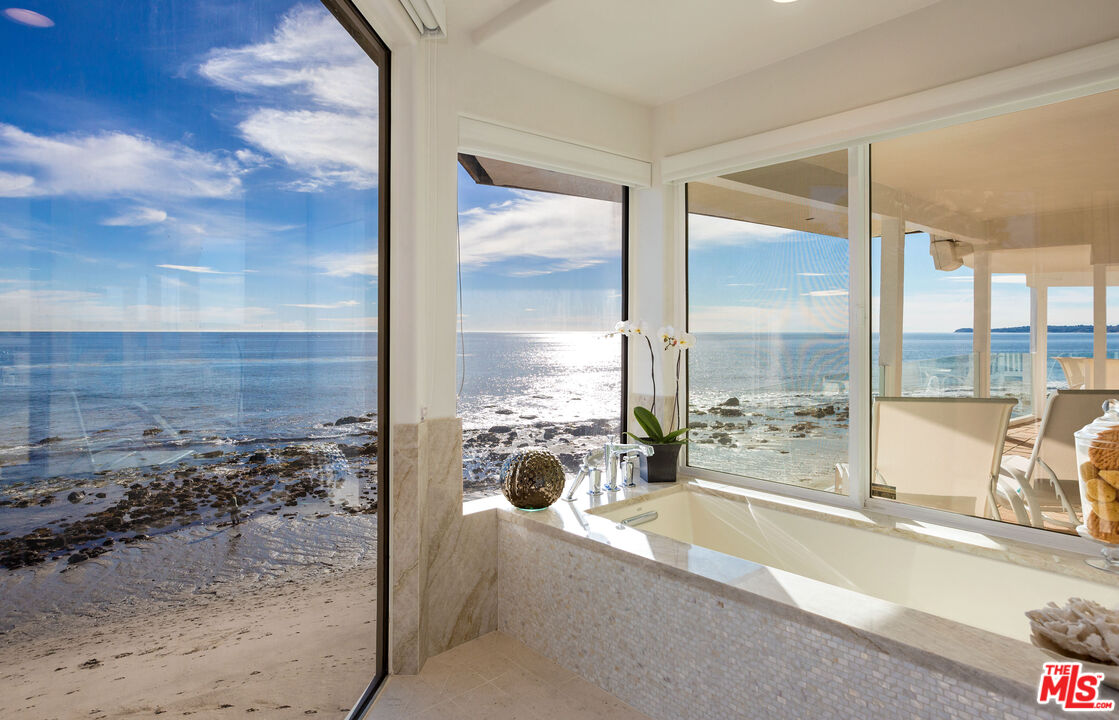 24408 Malibu Road Malibu, CA 90265 - Photo 32 of 44 a view of a balcony kitchen view and living room