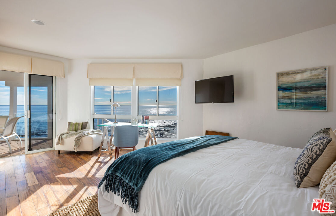 24408 Malibu Road Malibu, CA 90265 - Photo 36 of 44 a bedroom with two beds and large window