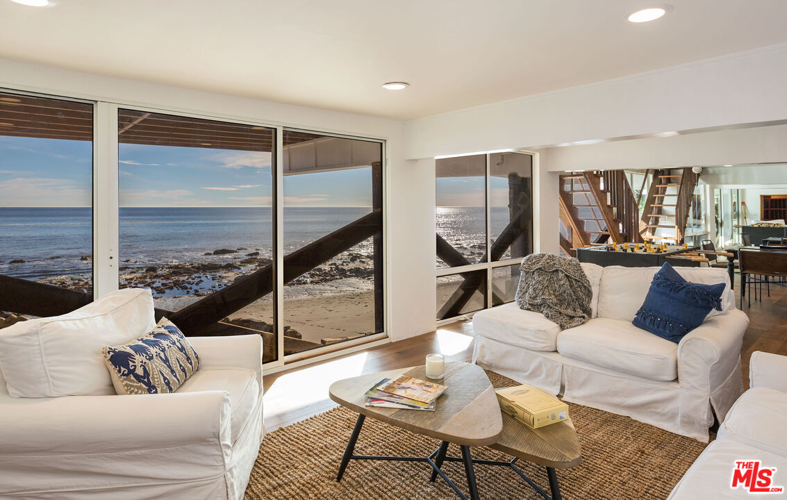 24408 Malibu Road Malibu, CA 90265 - Photo 39 of 44 a living room with furniture and a large window