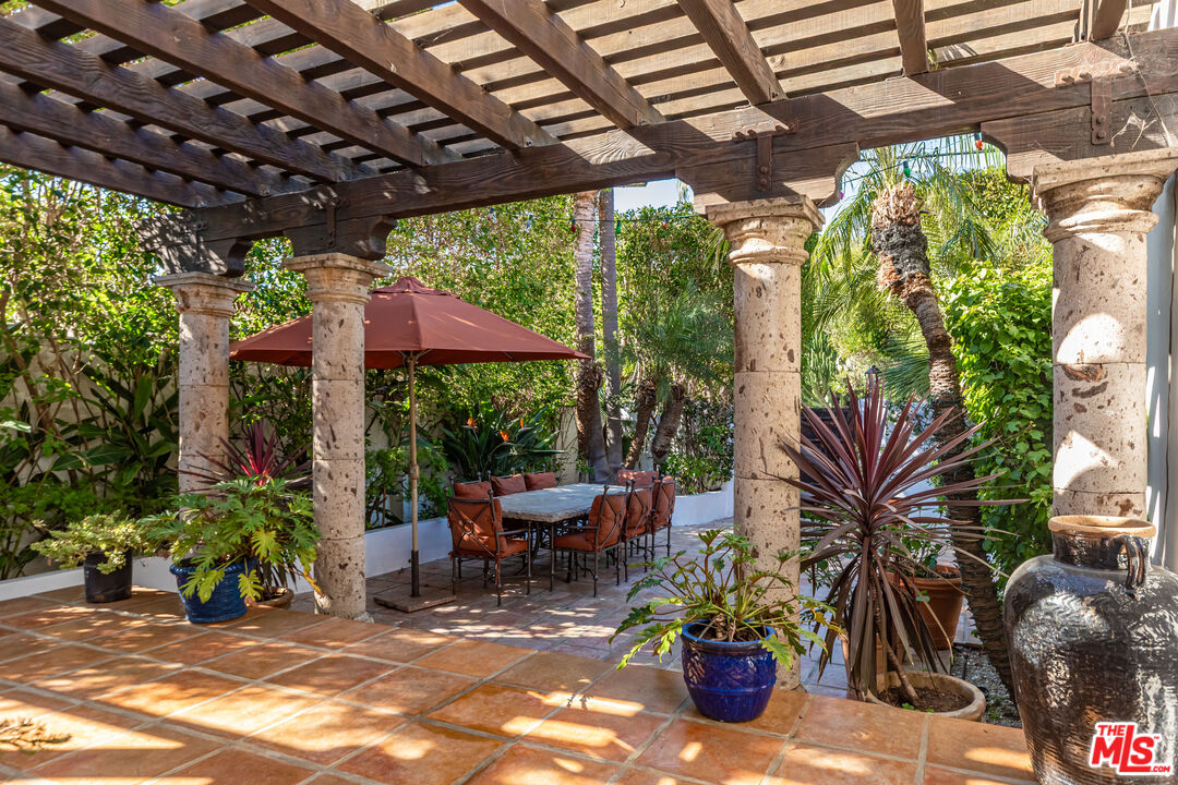 24408 Malibu Road Malibu, CA 90265 - Photo 6 of 39 a view of a chairs and table in a patio