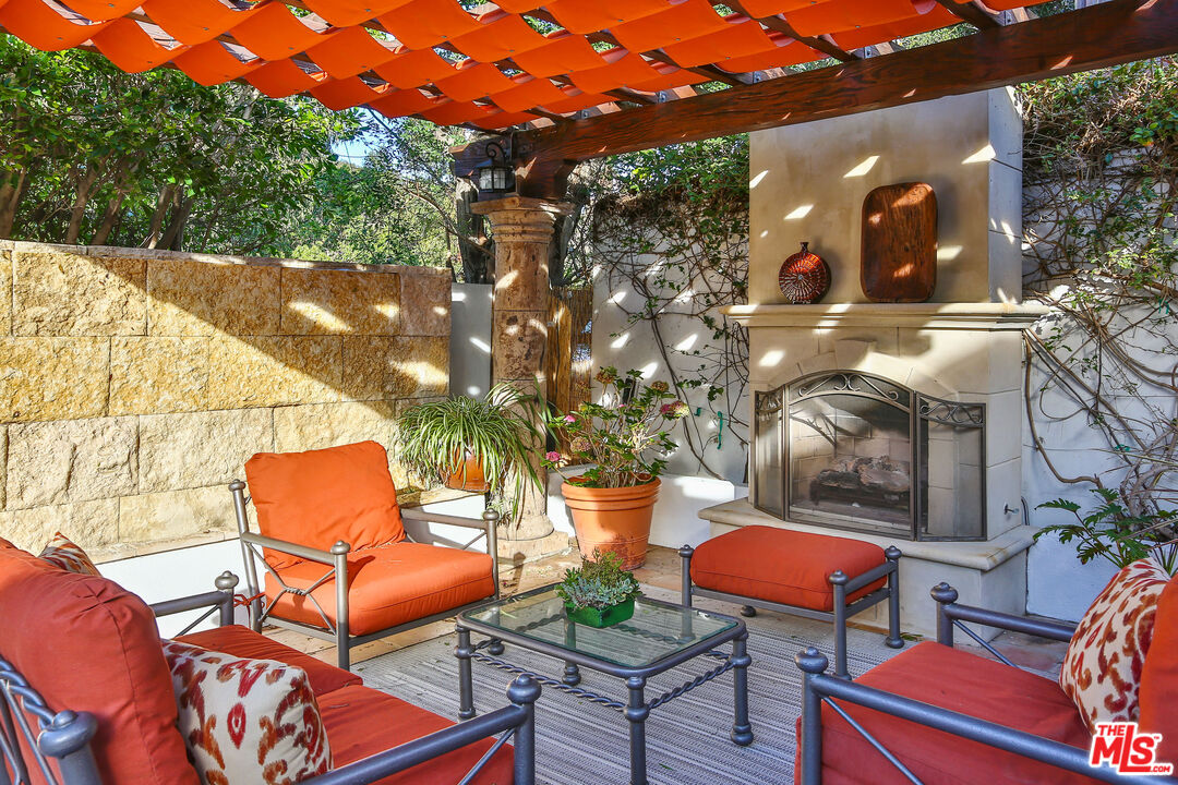 24408 Malibu Road Malibu, CA 90265 - Photo 8 of 44 a backyard of a house with table and chairs