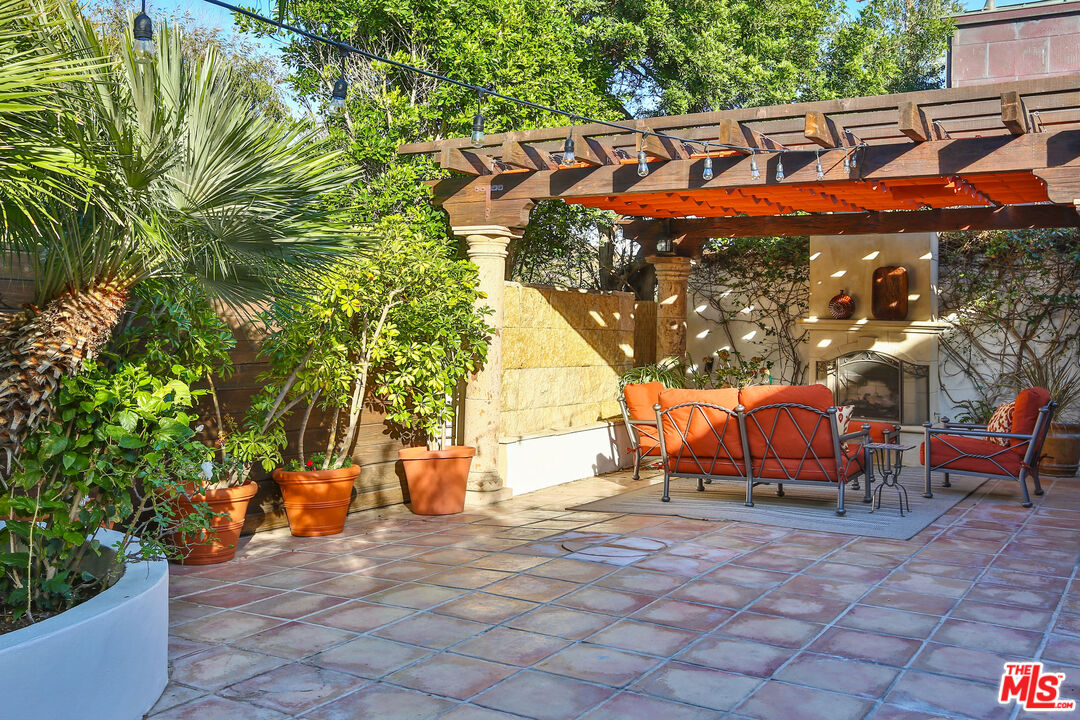 24408 Malibu Road Malibu, CA 90265 - Photo 9 of 44 an outdoor sitting area with a furniture and garden