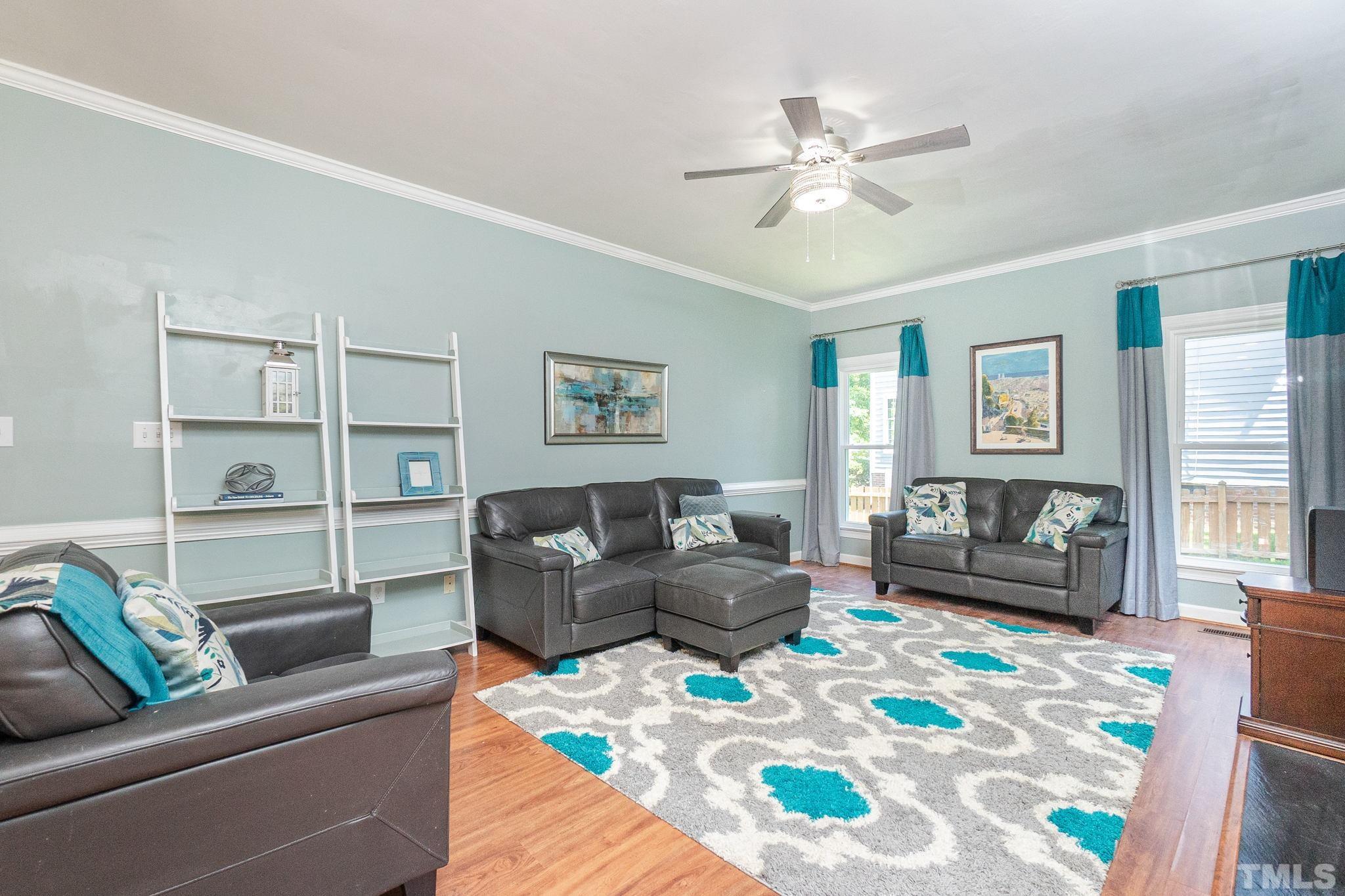 5717 Raddington Street Raleigh, NC 27613 - Photo 24 of 58 a living room with furniture and a couch