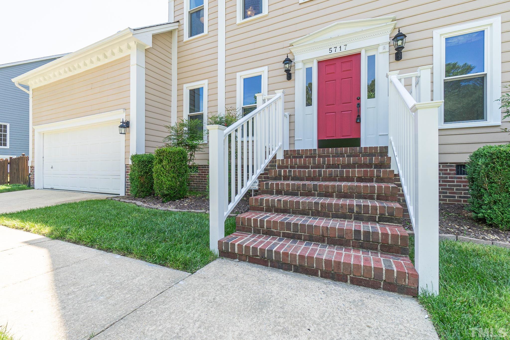 5717 Raddington Street Raleigh, NC 27613 - Photo 3 of 58 a view of a house with a yard and stairs
