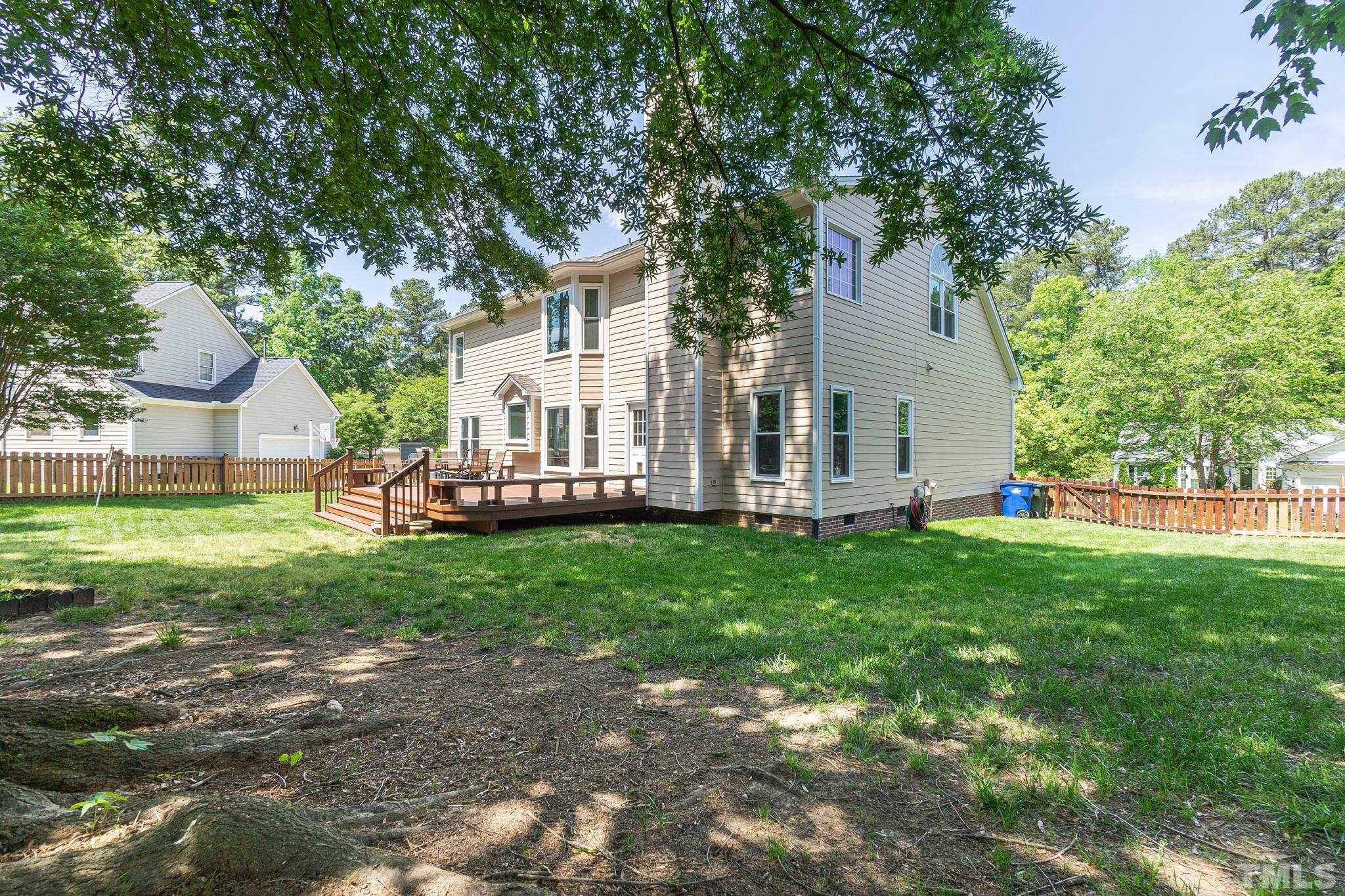 5717 Raddington Street Raleigh, NC 27613 - Photo 47 of 58 a view of backyard of house with green space