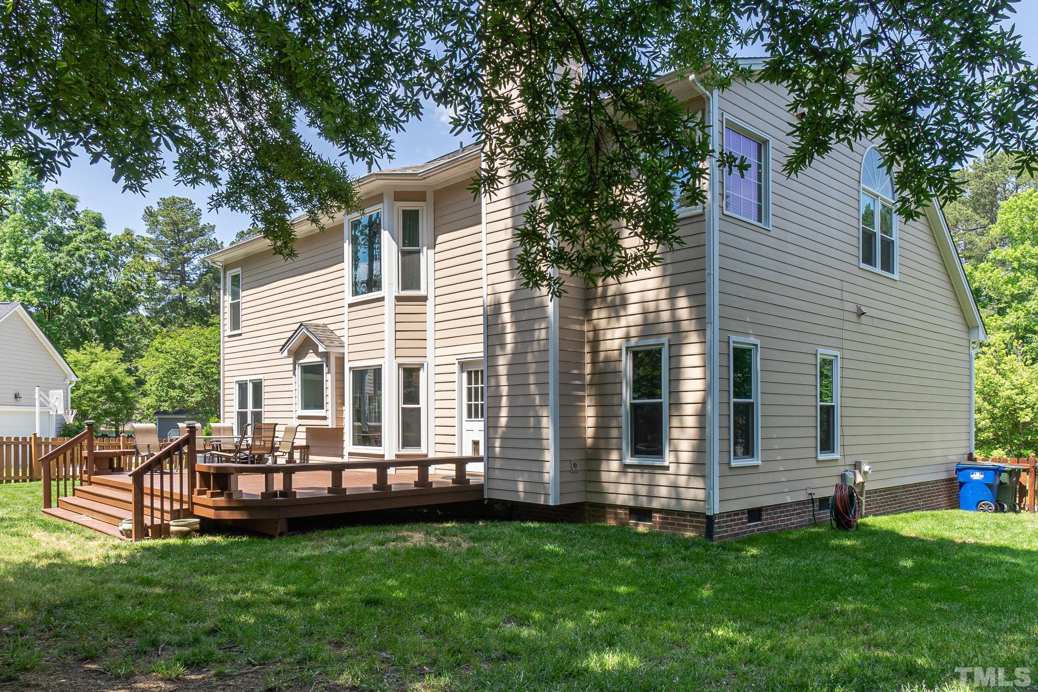 5717 Raddington Street Raleigh, NC 27613 - Photo 48 of 58 a view of a house with backyard and a tree