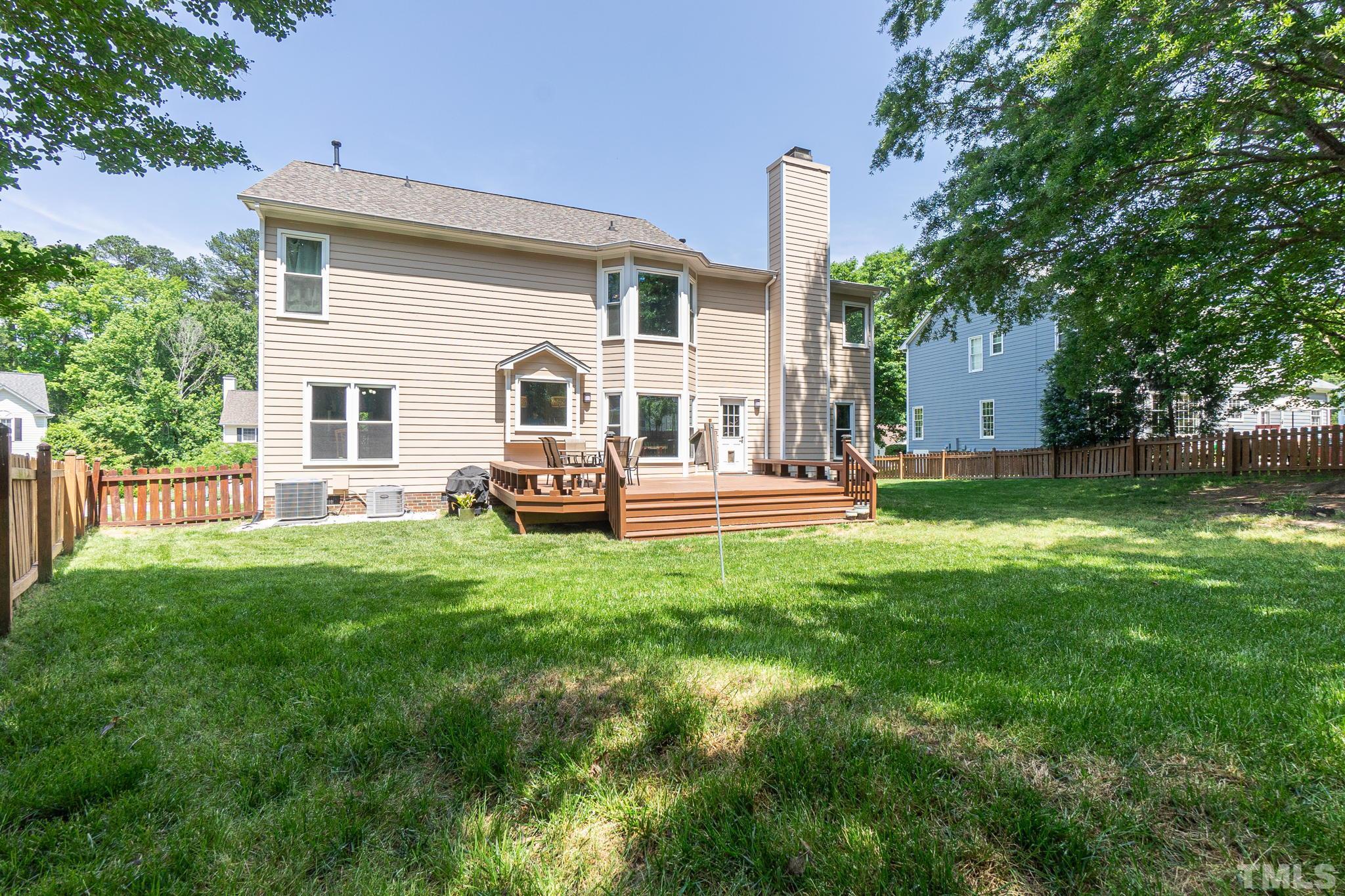 5717 Raddington Street Raleigh, NC 27613 - Photo 51 of 58 a view of a house with backyard and porch