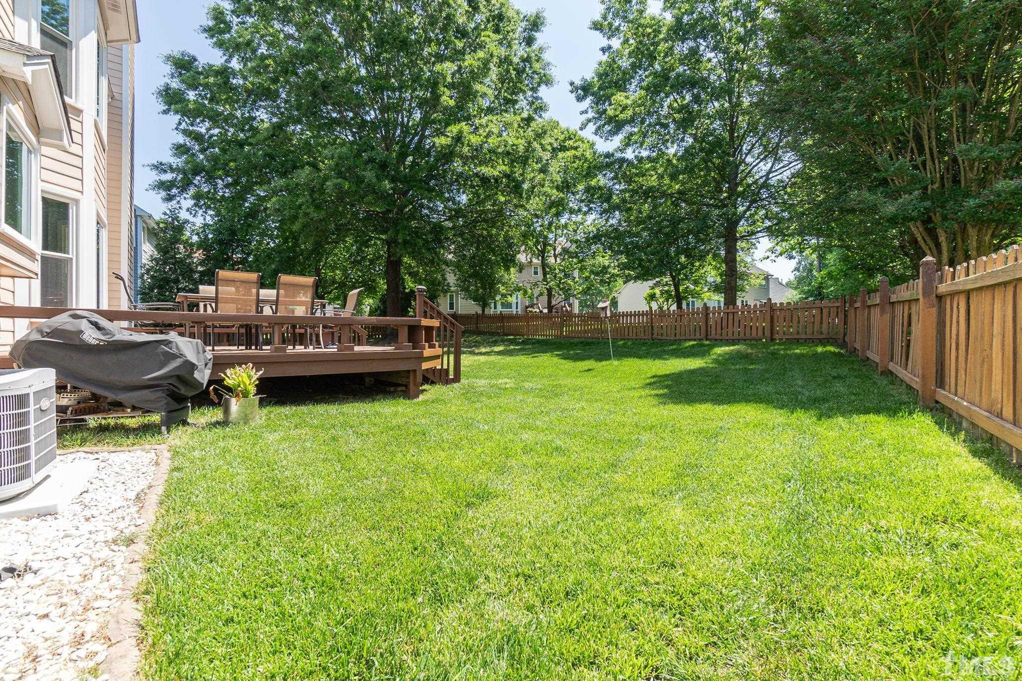 5717 Raddington Street Raleigh, NC 27613 - Photo 53 of 58 a view of backyard with seating area