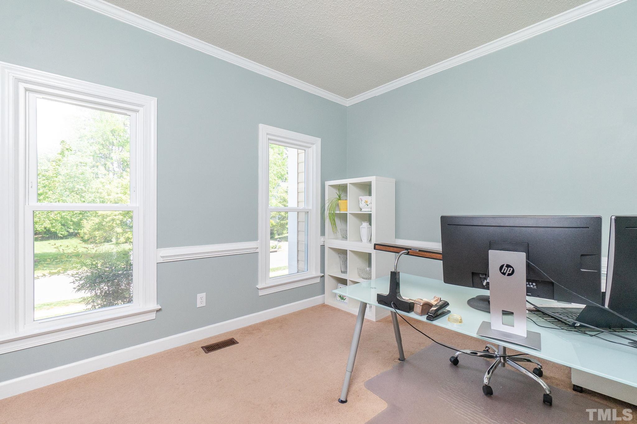 5717 Raddington Street Raleigh, NC 27613 - Photo 6 of 58 a view of a workspace with a window