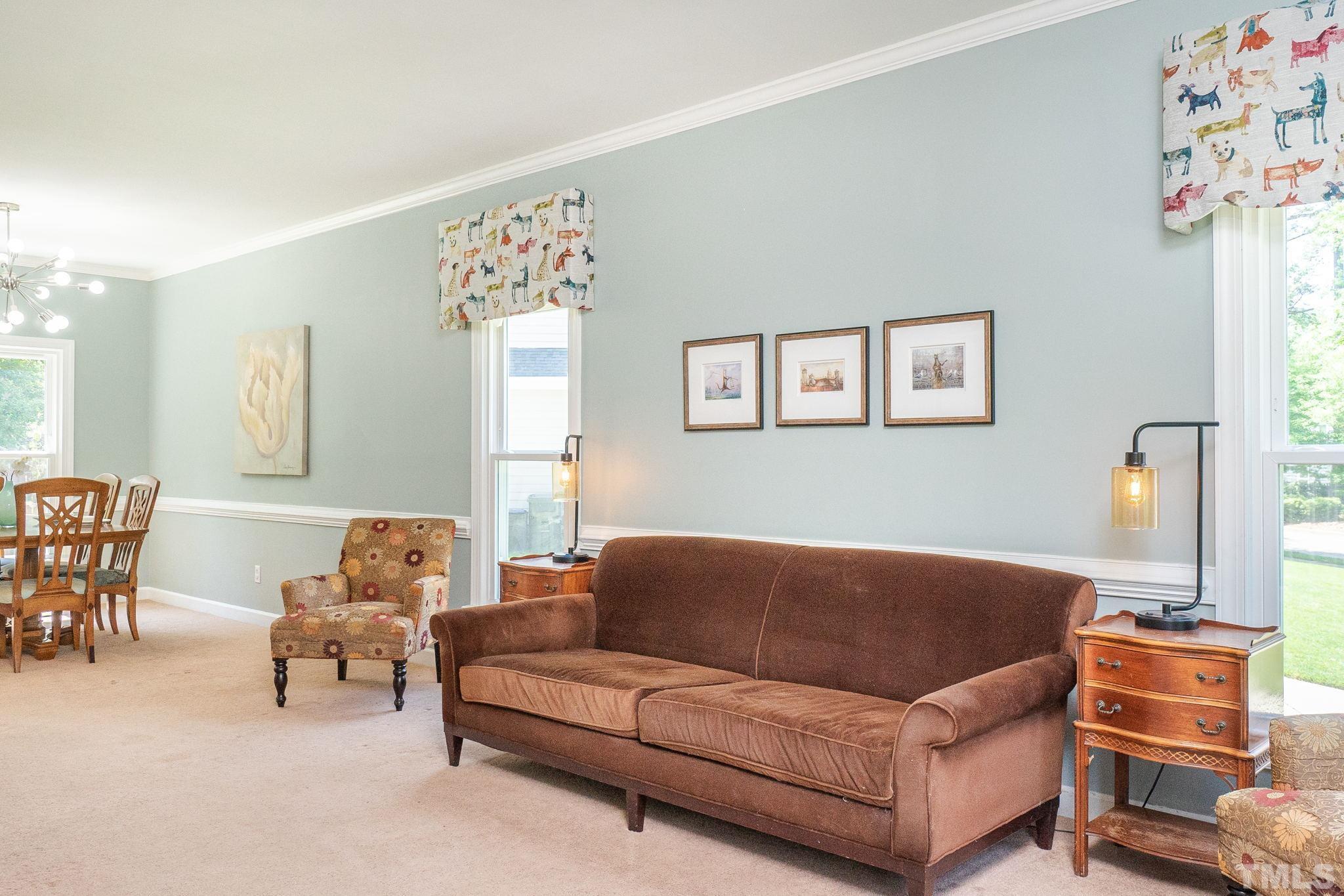 5717 Raddington Street Raleigh, NC 27613 - Photo 8 of 58 a living room with furniture and a window
