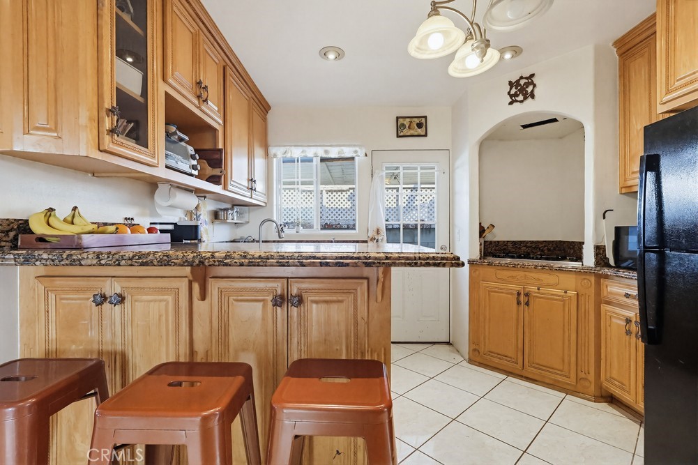 10970 Ruth Avenue Lynwood, CA 90262 - Photo 11 of 27 a kitchen with stainless steel appliances granite countertop a sink and cabinets
