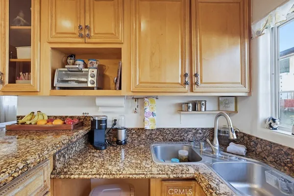 a kitchen with a stove and cabinets