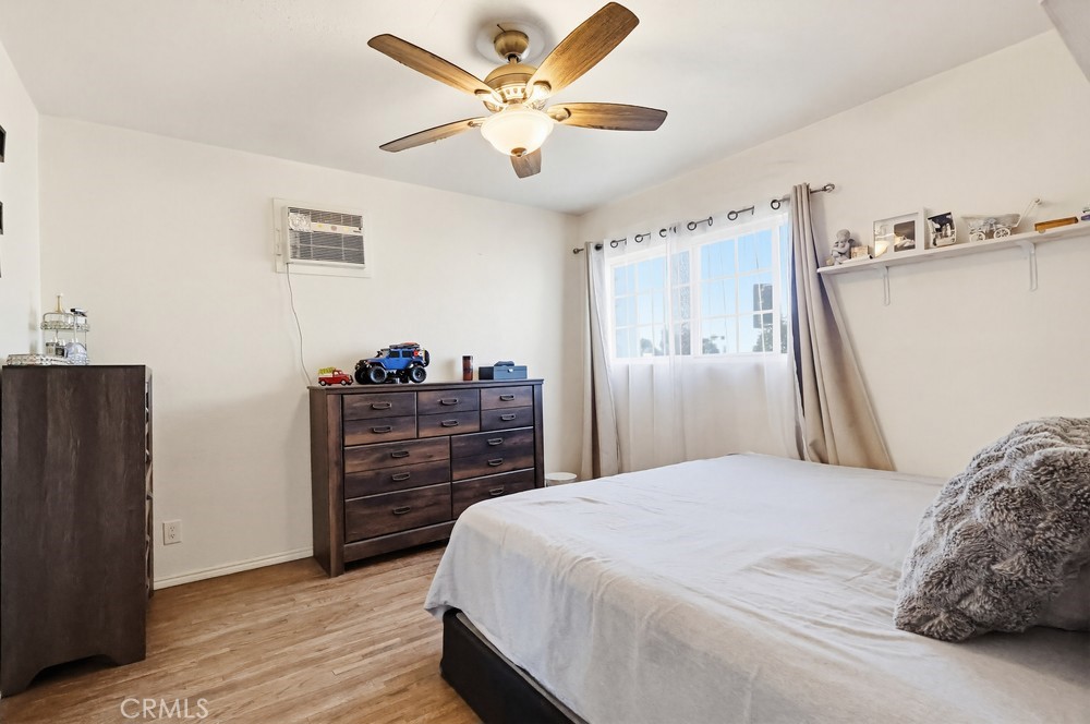 10970 Ruth Avenue Lynwood, CA 90262 - Photo 13 of 27 a bedroom with a bed and a dresser