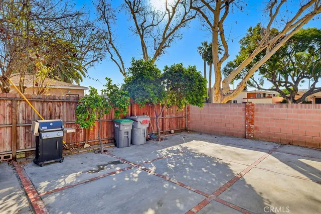 a view of a backyard with large trees
