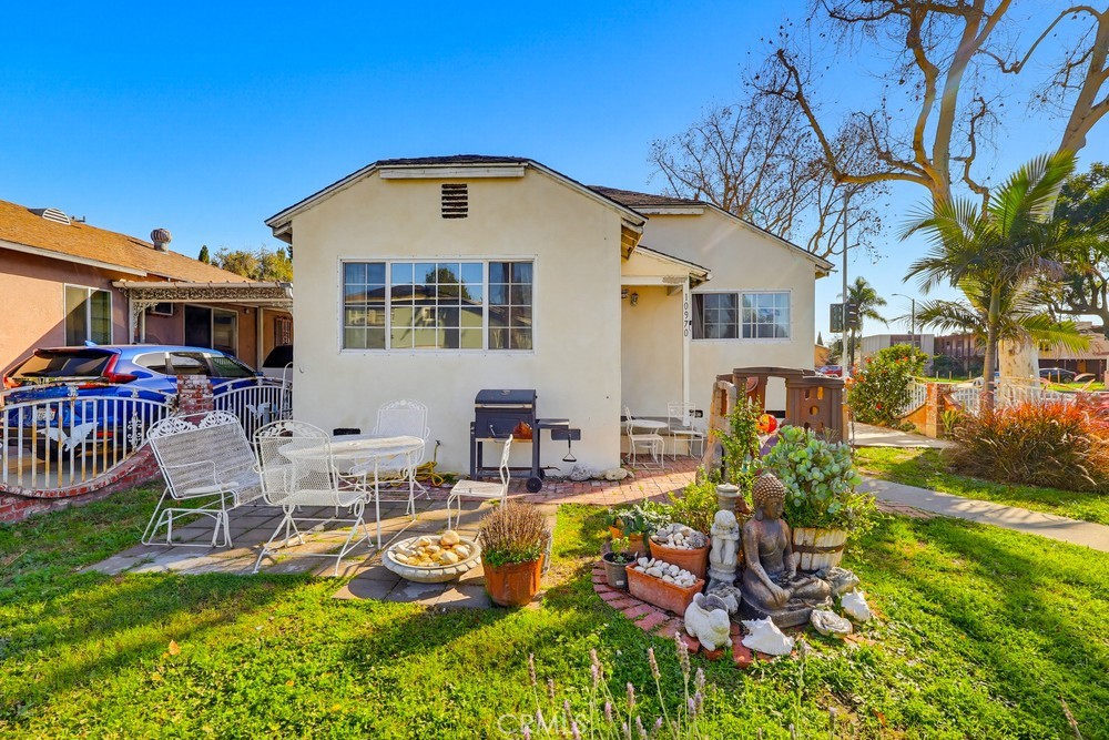 10970 Ruth Avenue Lynwood, CA 90262 - Photo 4 of 27 a front view of house with yard and outdoor seating
