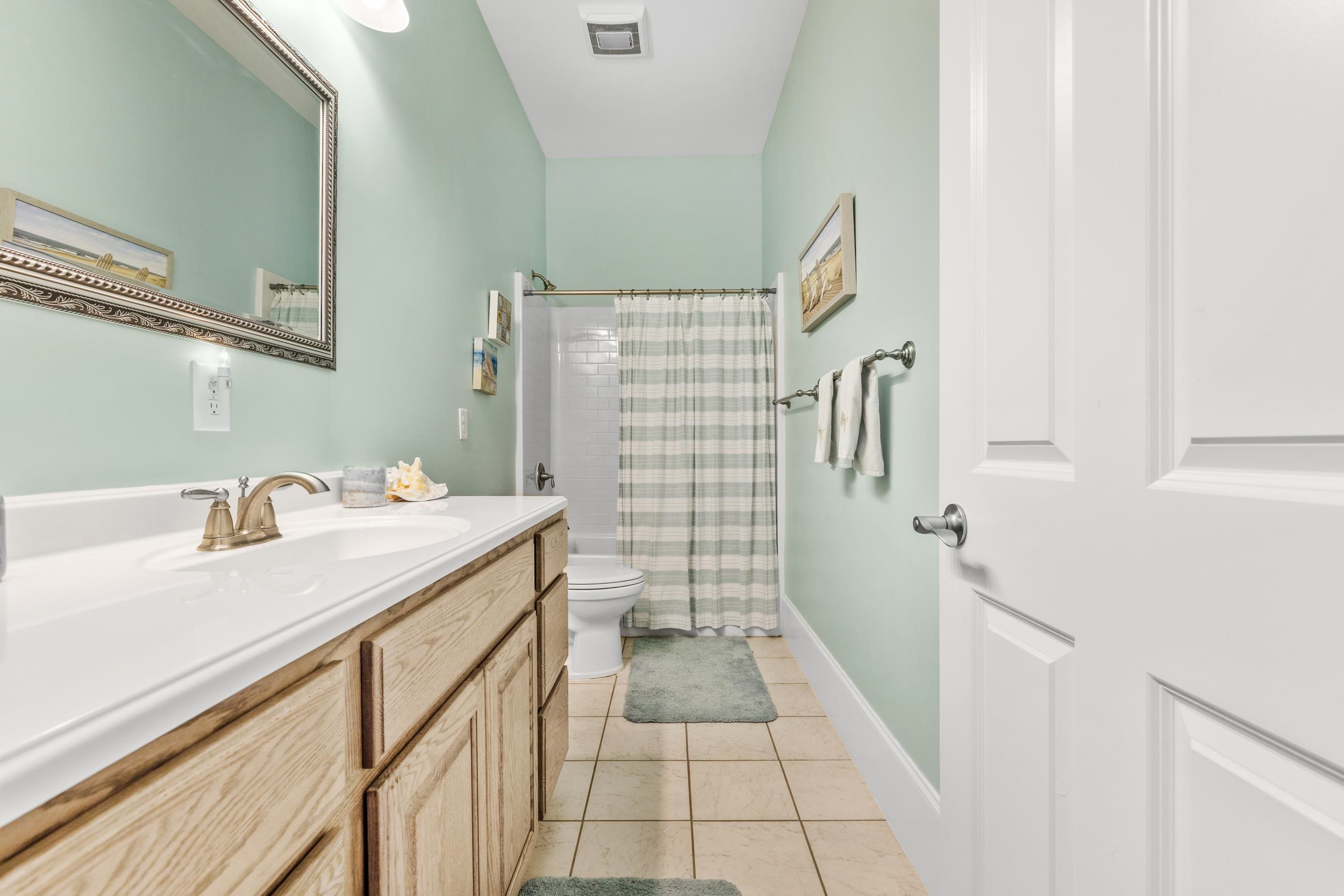 5907 Haskell Circle Myrtle Beach, SC 29577 - Photo 15 of 38 Full bathroom featuring curtained shower, vanity, and light tile patterned flooring