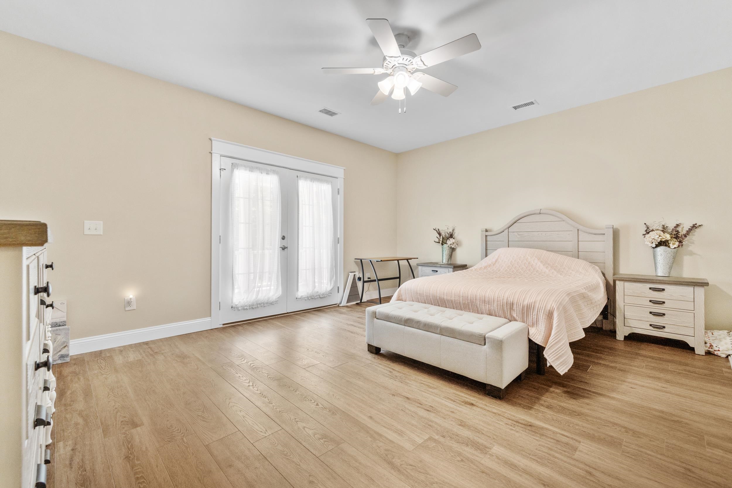 5907 Haskell Circle Myrtle Beach, SC 29577 - Photo 16 of 38 Bedroom featuring access to exterior, light wood-style floors, french doors, and ceiling fan