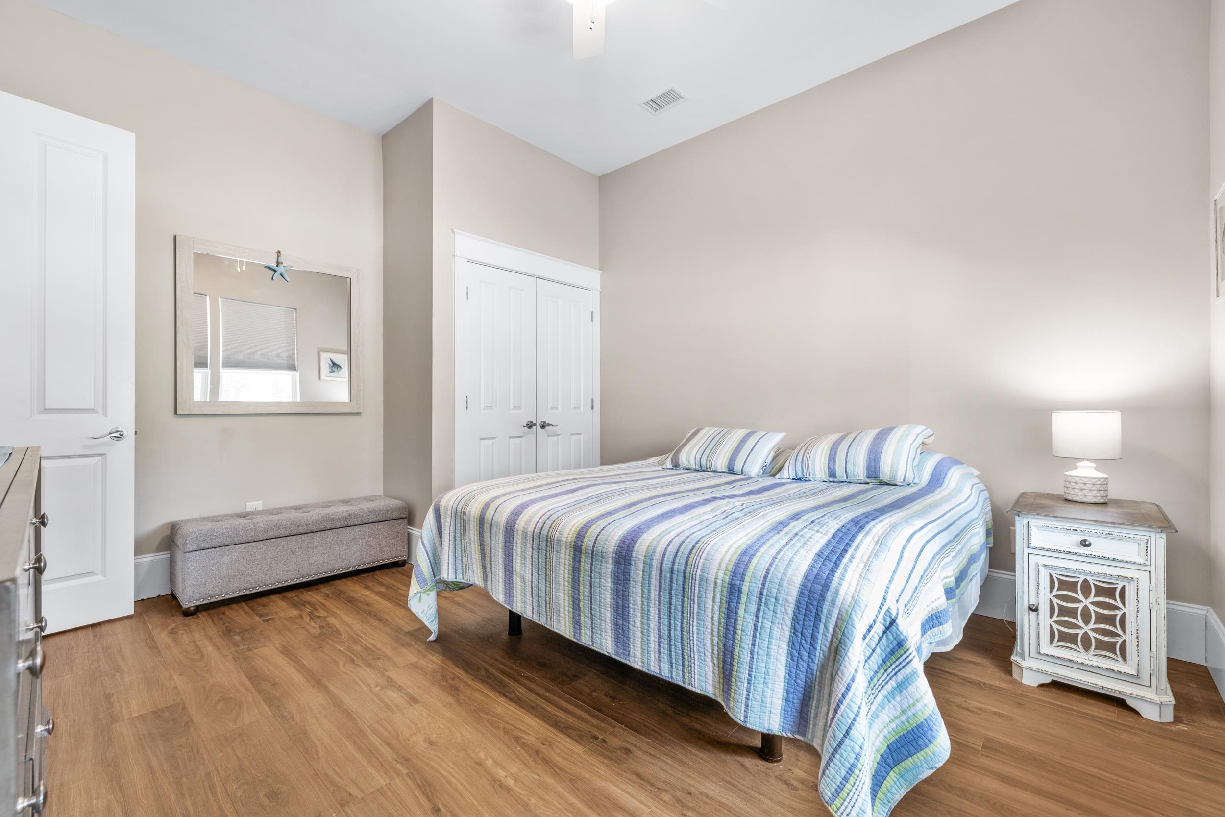 5907 Haskell Circle Myrtle Beach, SC 29577 - Photo 21 of 38 Bedroom featuring a closet, light wood-style flooring, and ceiling fan