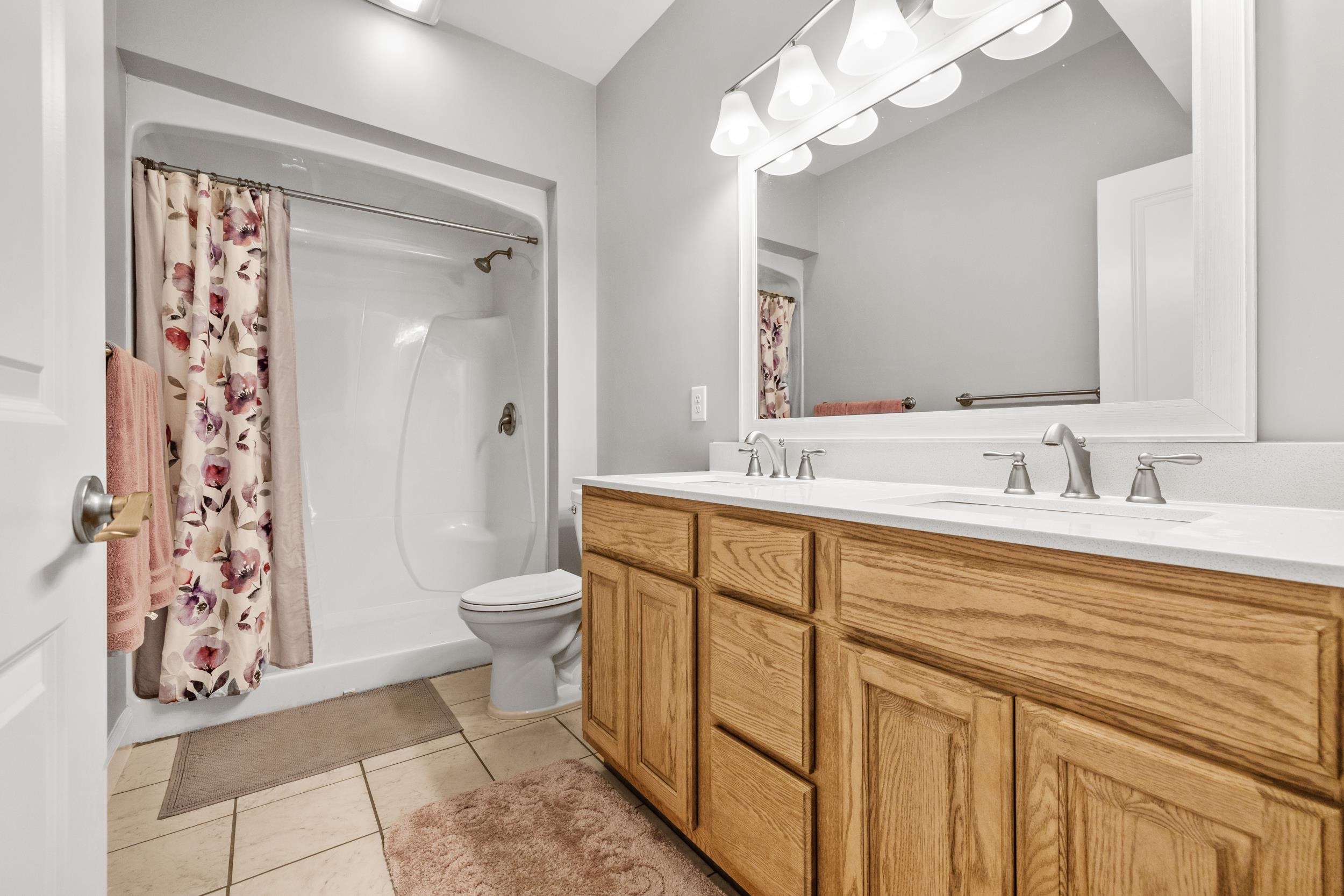 5907 Haskell Circle Myrtle Beach, SC 29577 - Photo 30 of 38 Full bathroom with double vanity, a shower stall, and light tile patterned floors