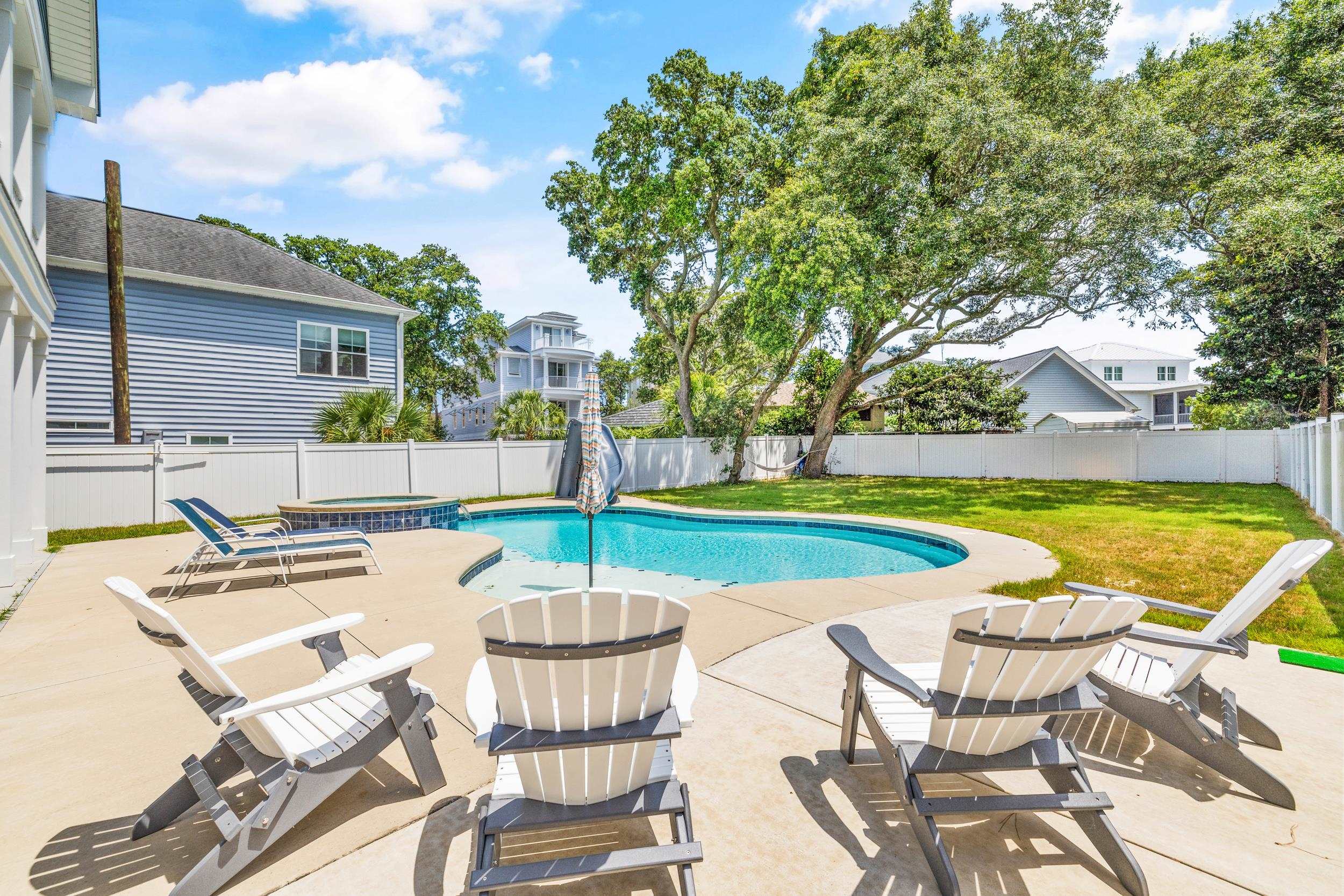 5907 Haskell Circle Myrtle Beach, SC 29577 - Photo 35 of 38 View of swimming pool featuring a patio area, a fenced backyard, and a pool with connected hot tub