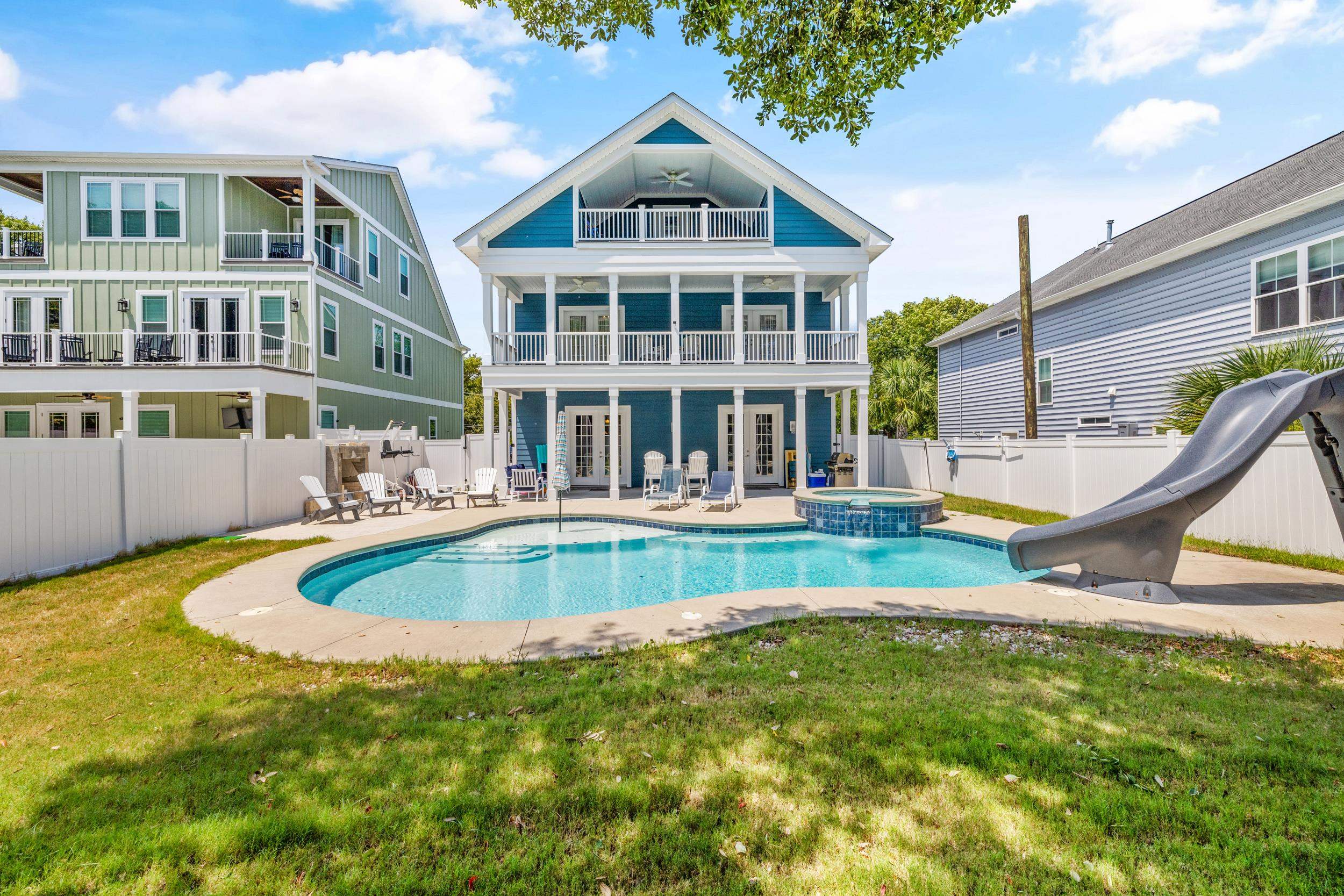 5907 Haskell Circle Myrtle Beach, SC 29577 - Photo 36 of 38 Back of property featuring a patio area, french doors, a fenced backyard, board and batten siding, and a balcony