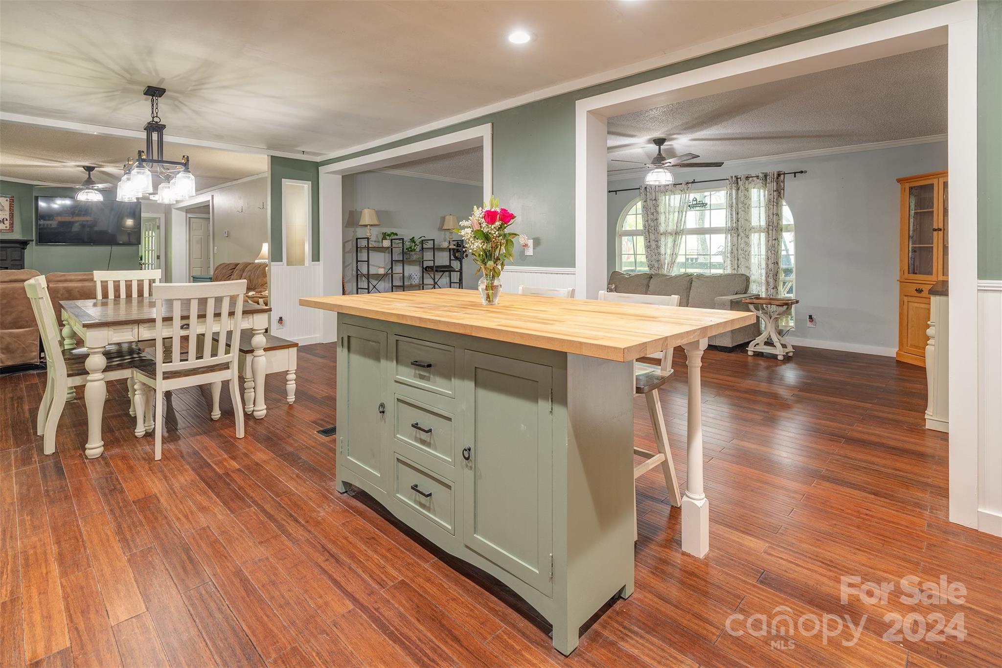 677 Short Ridge Lane Clyde, NC 28721 - Photo 13 of 30 a view of a dining room with furniture window and wooden floor
