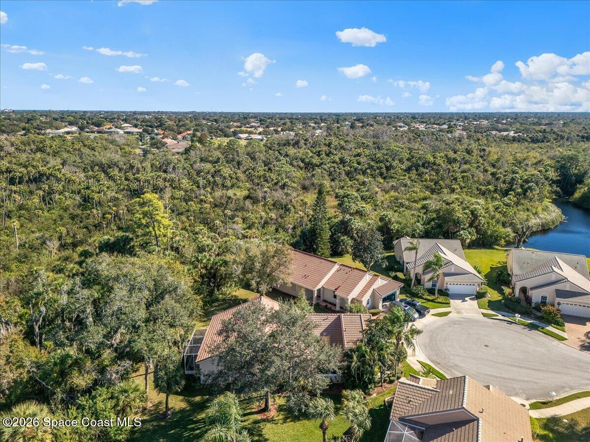 8200 Simpkins Way Melbourne, FL 32940 - Photo 14 of 49 an aerial view of a house with a yard