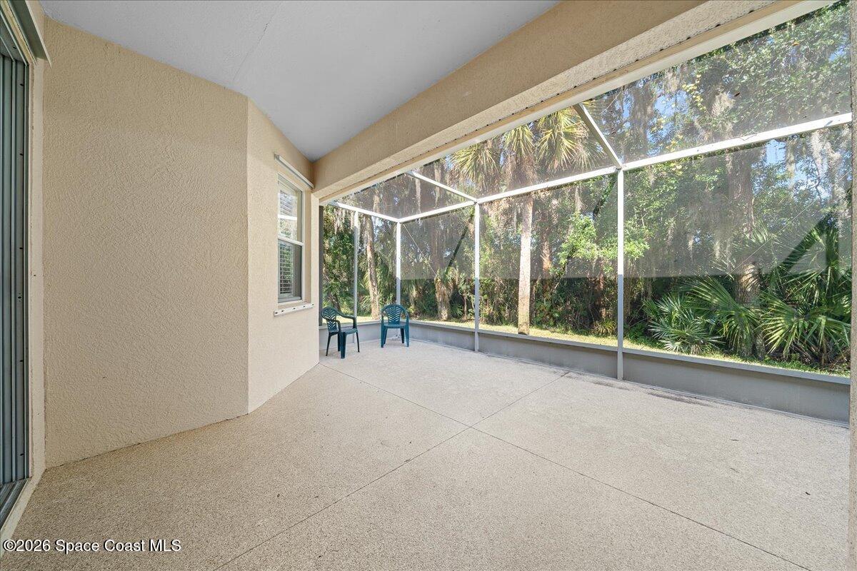 8200 Simpkins Way Melbourne, FL 32940 - Photo 17 of 49 a view of an empty room with floor to ceiling windows and yard