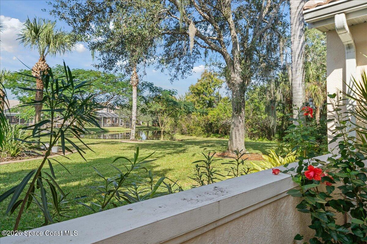 8200 Simpkins Way Melbourne, FL 32940 - Photo 18 of 49 a view of a garden with flowers