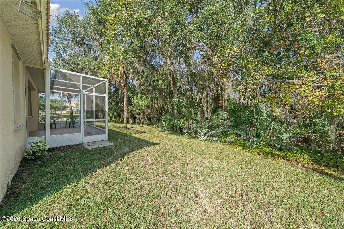 8200 Simpkins Way Melbourne, FL 32940 - Photo 19 of 49 a view of yard with patio