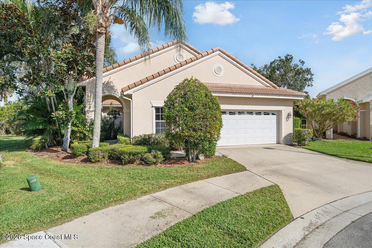 8200 Simpkins Way Melbourne, FL 32940 - Photo 2 of 49 a front view of a house with a yard