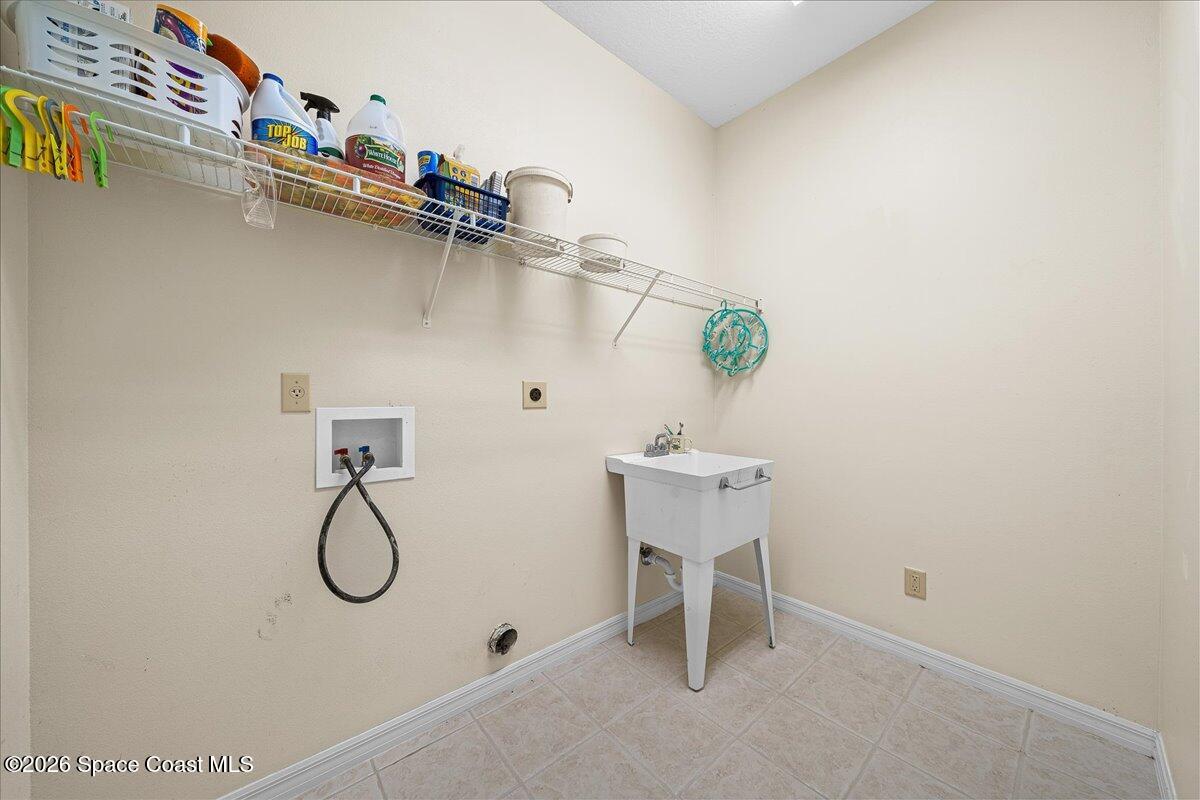 8200 Simpkins Way Melbourne, FL 32940 - Photo 25 of 49 a view of a room with rack on the wall