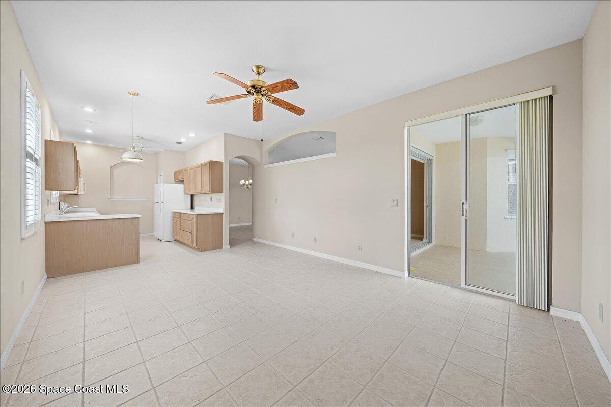 8200 Simpkins Way Melbourne, FL 32940 - Photo 29 of 49 a view of a kitchen with a sink and a cabinet wooden floor windows
