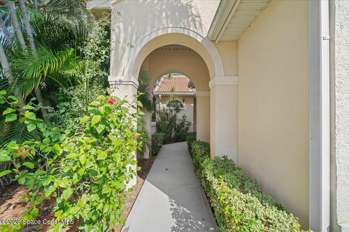 8200 Simpkins Way Melbourne, FL 32940 - Photo 3 of 49 a view of entryway with garden