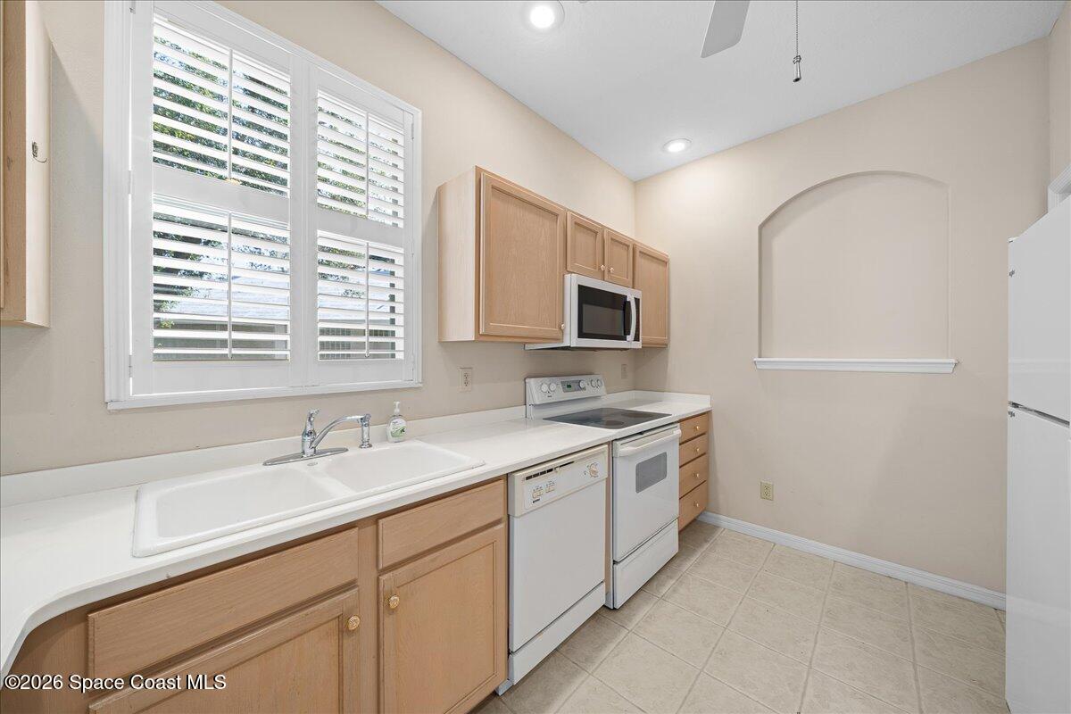 8200 Simpkins Way Melbourne, FL 32940 - Photo 31 of 49 a spacious bathroom with a double vanity sink a mirror and a bathtub