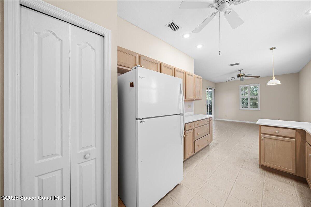 8200 Simpkins Way Melbourne, FL 32940 - Photo 32 of 49 a white refrigerator freezer sitting inside of a kitchen