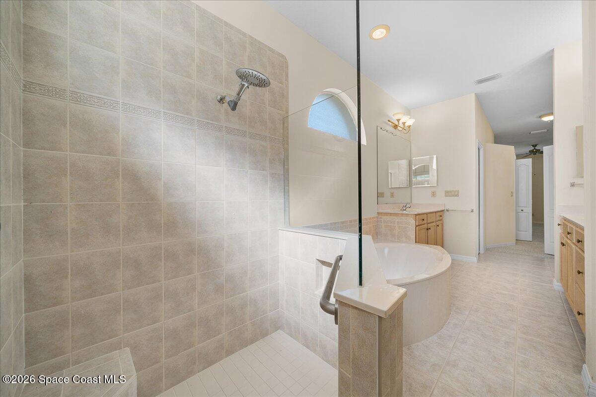 8200 Simpkins Way Melbourne, FL 32940 - Photo 39 of 49 a bathroom with a shower and a sink