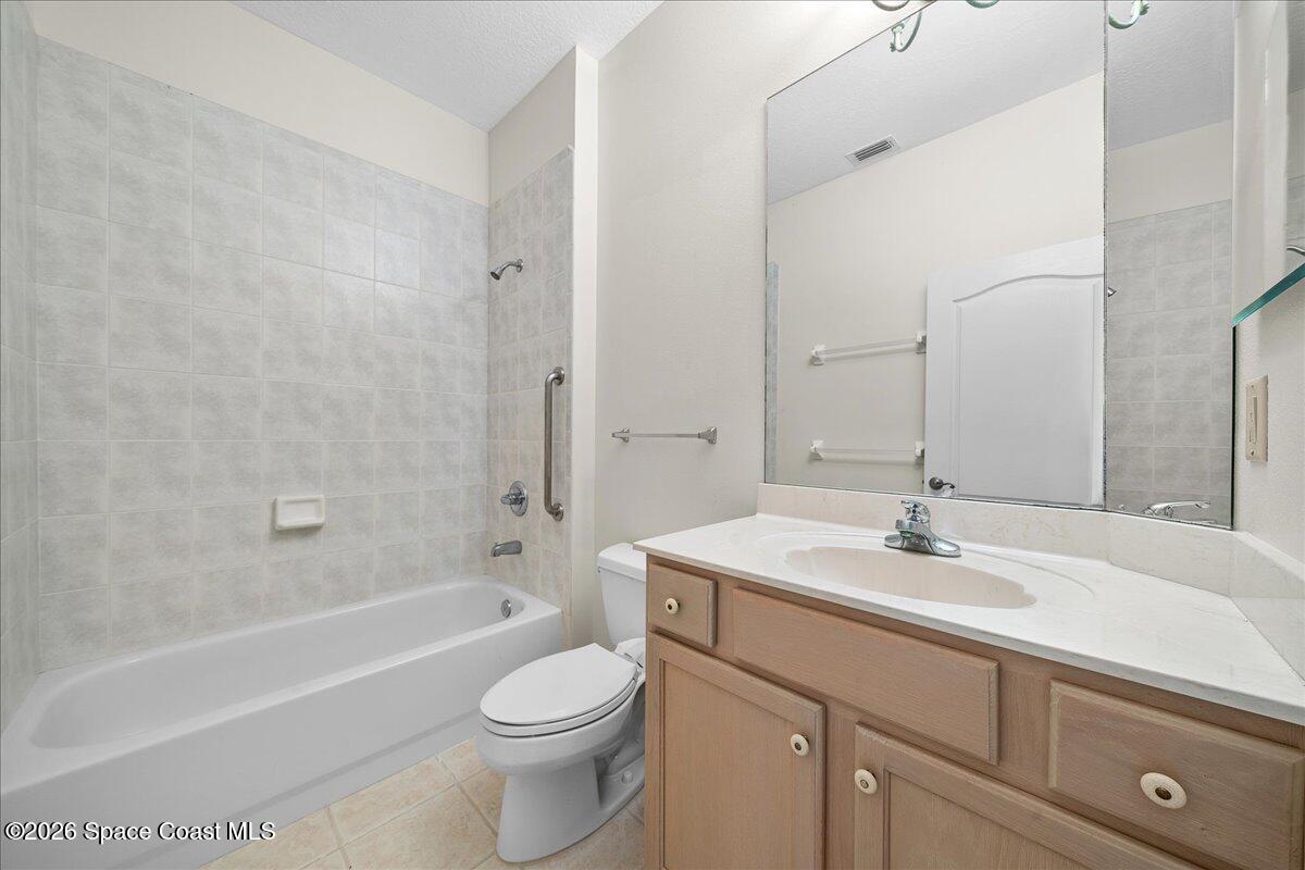 8200 Simpkins Way Melbourne, FL 32940 - Photo 41 of 49 a bathroom with a sink a toilet and shower