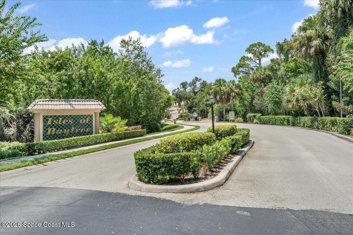 8200 Simpkins Way Melbourne, FL 32940 - Photo 43 of 49 a view of a street with a house in the background