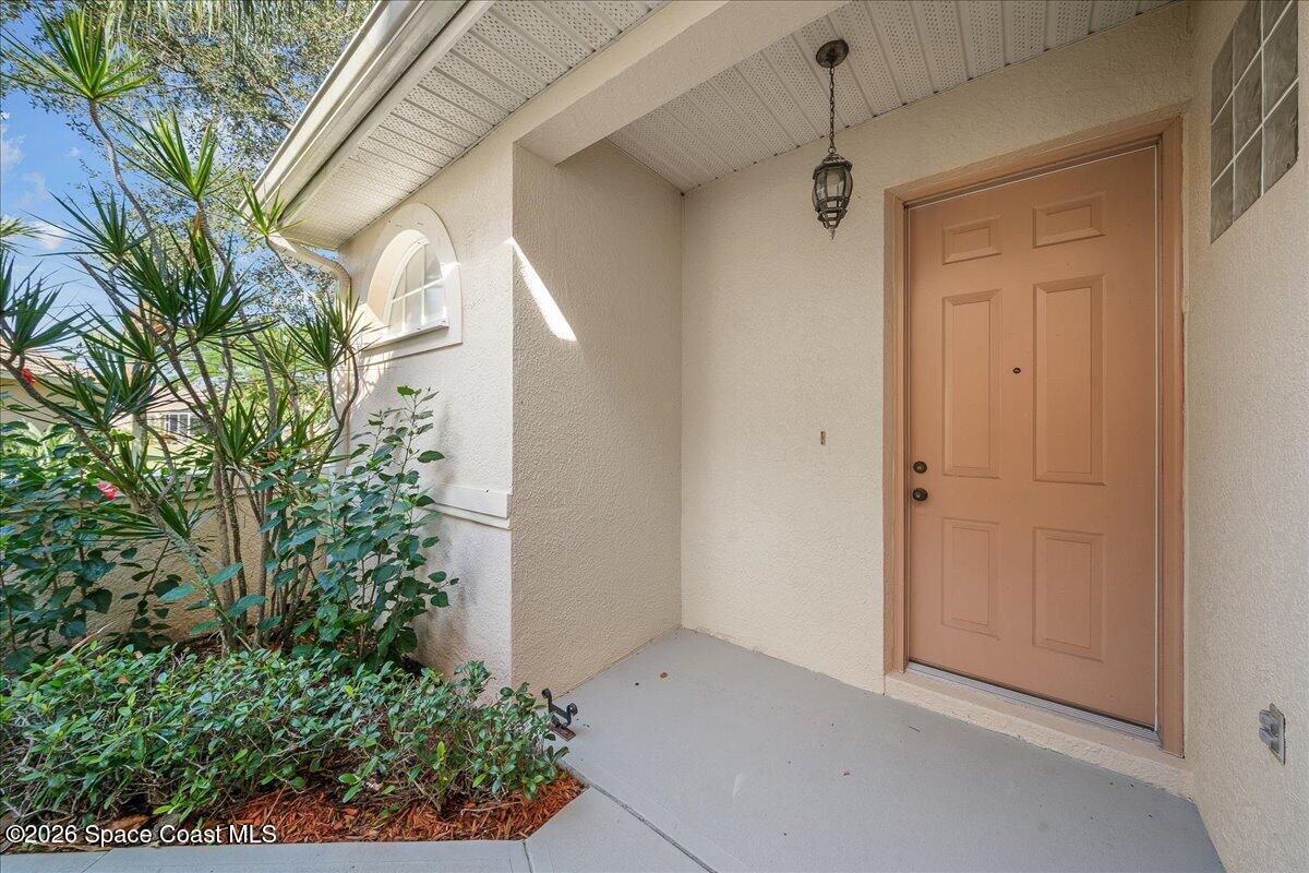 8200 Simpkins Way Melbourne, FL 32940 - Photo 5 of 49 a view of a house with a potted plant
