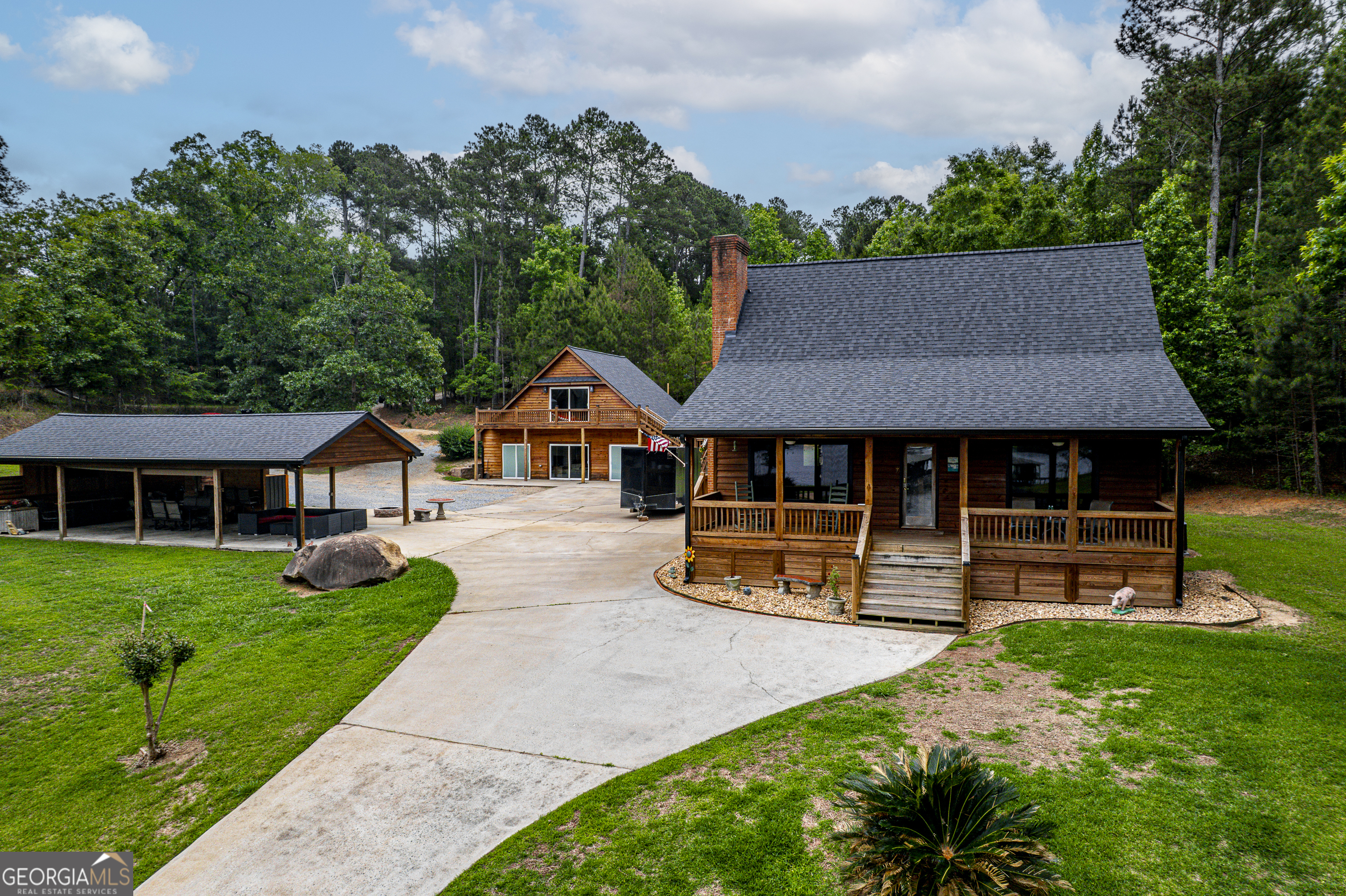 63 Tomahawk Drive Sparta, GA 31087 - Photo 2 of 60 a view of a house with a yard