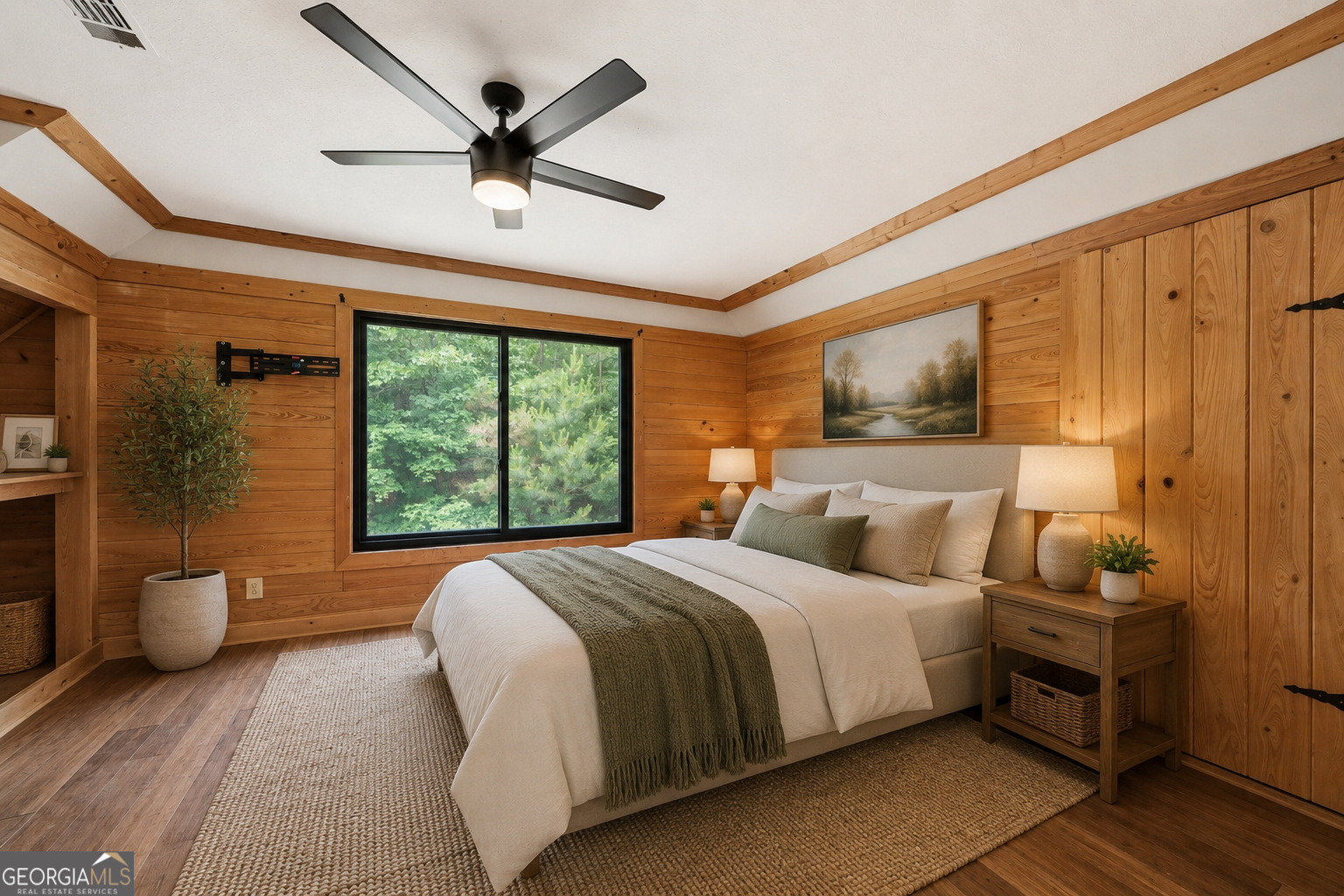 63 Tomahawk Drive Sparta, GA 31087 - Photo 23 of 60 a bedroom with a bed and a large window