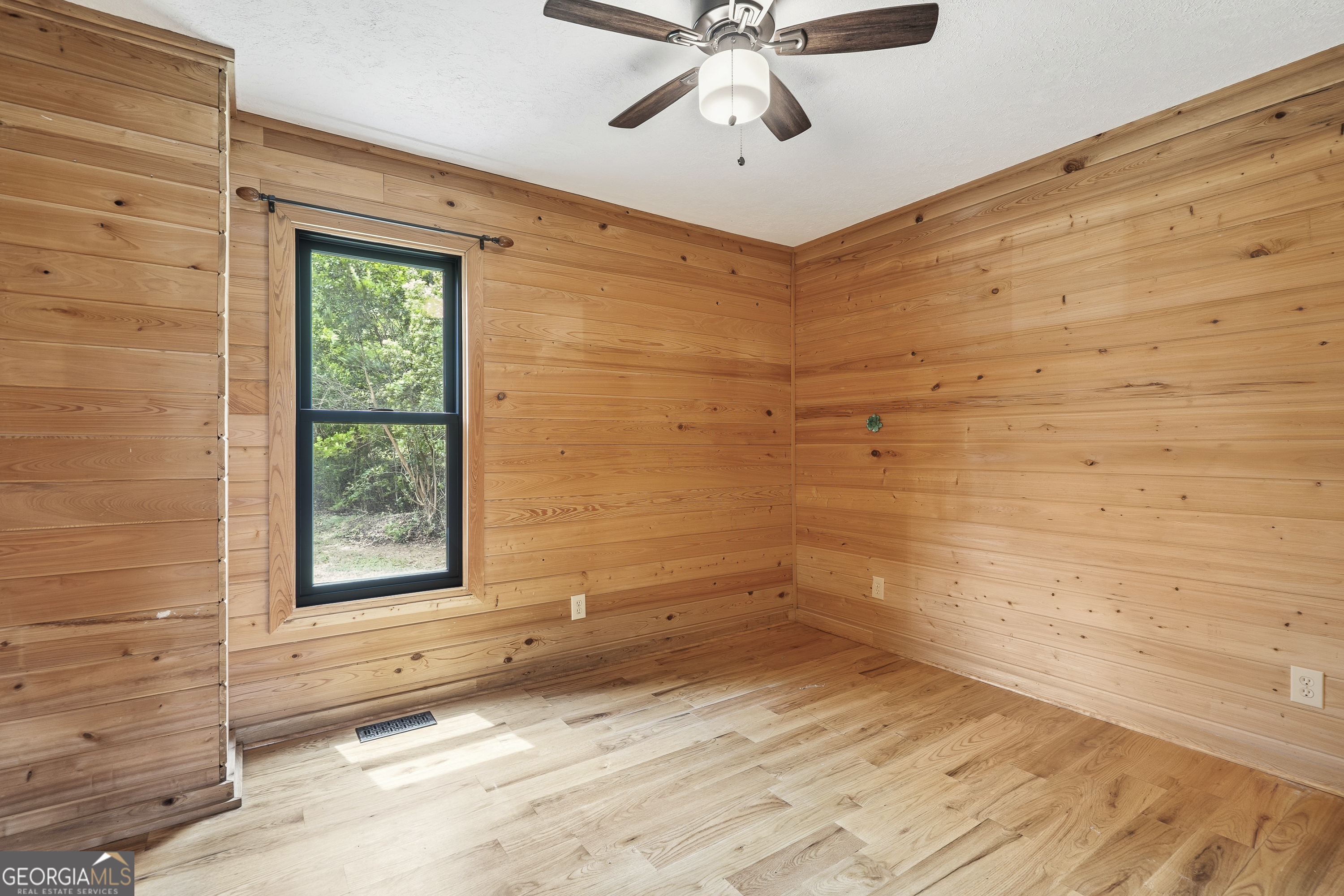 63 Tomahawk Drive Sparta, GA 31087 - Photo 33 of 60 a view of a livingroom with a ceiling fan and window