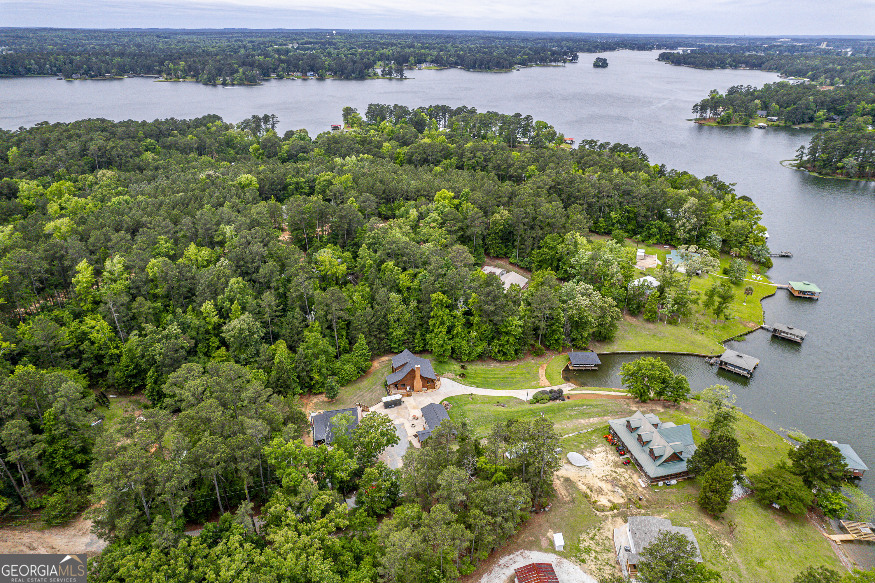63 Tomahawk Drive Sparta, GA 31087 - Photo 42 of 60 an aerial view of a houses with a lake view