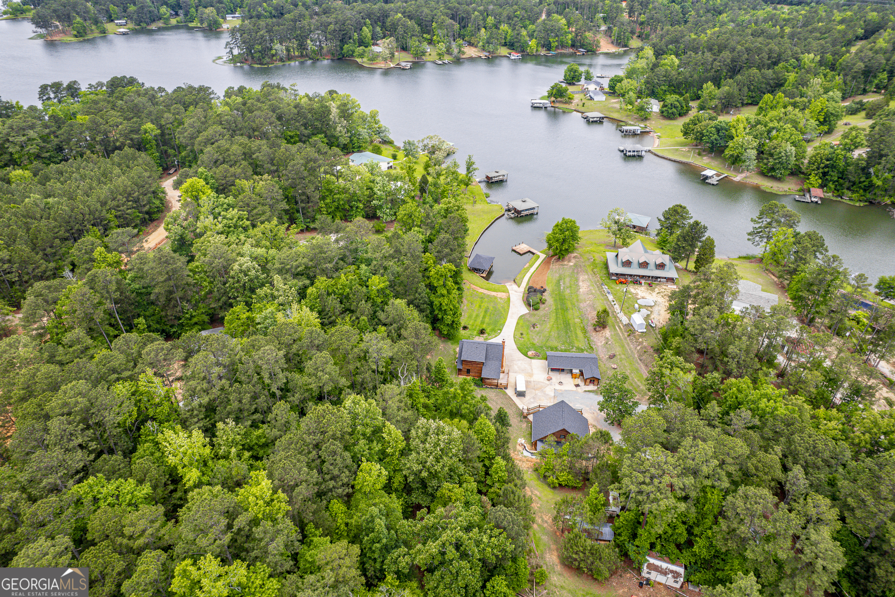 63 Tomahawk Drive Sparta, GA 31087 - Photo 44 of 60 an aerial view of residential houses with outdoor space and lake view