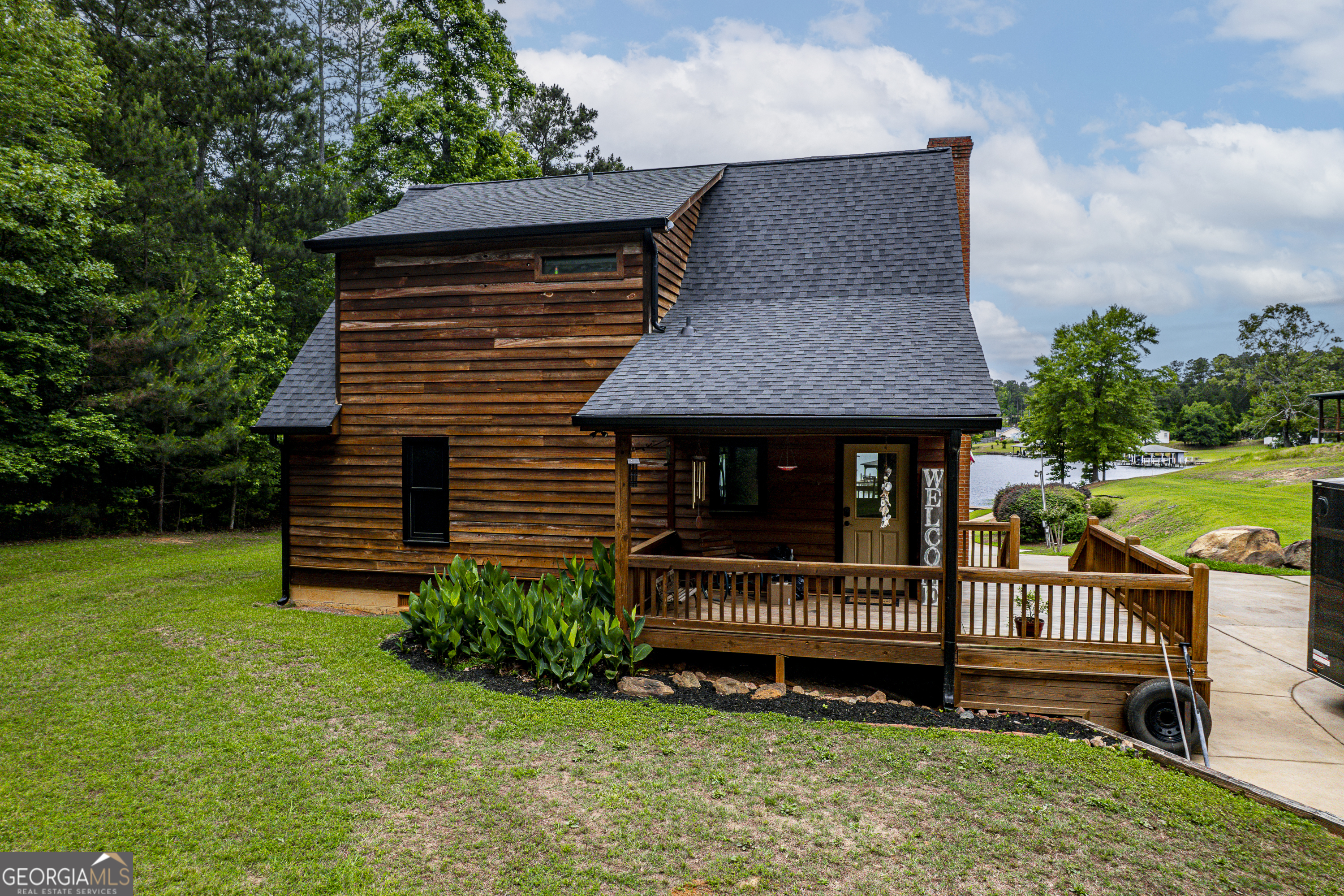 63 Tomahawk Drive Sparta, GA 31087 - Photo 48 of 60 a view of a house with a yard and deck