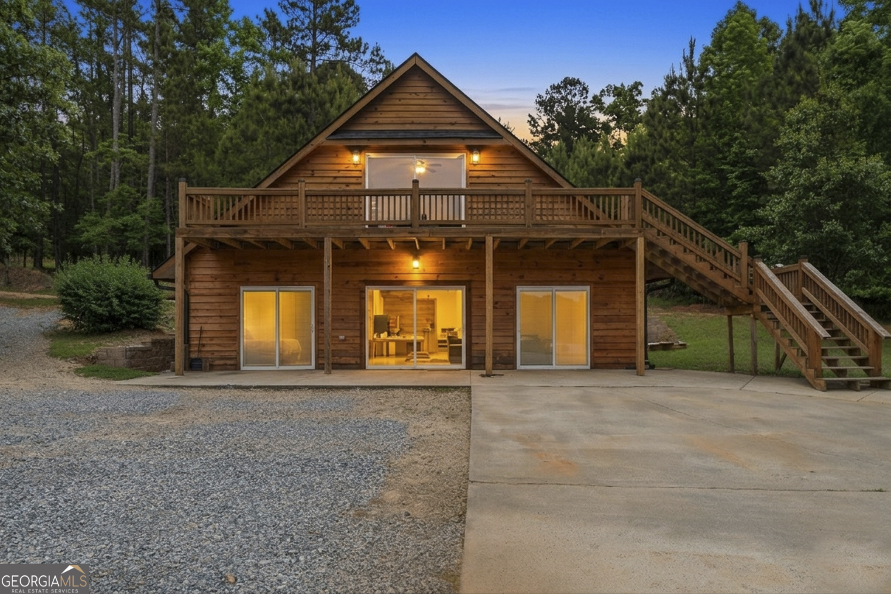 63 Tomahawk Drive Sparta, GA 31087 - Photo 49 of 60 a front view of a house with a yard and garage